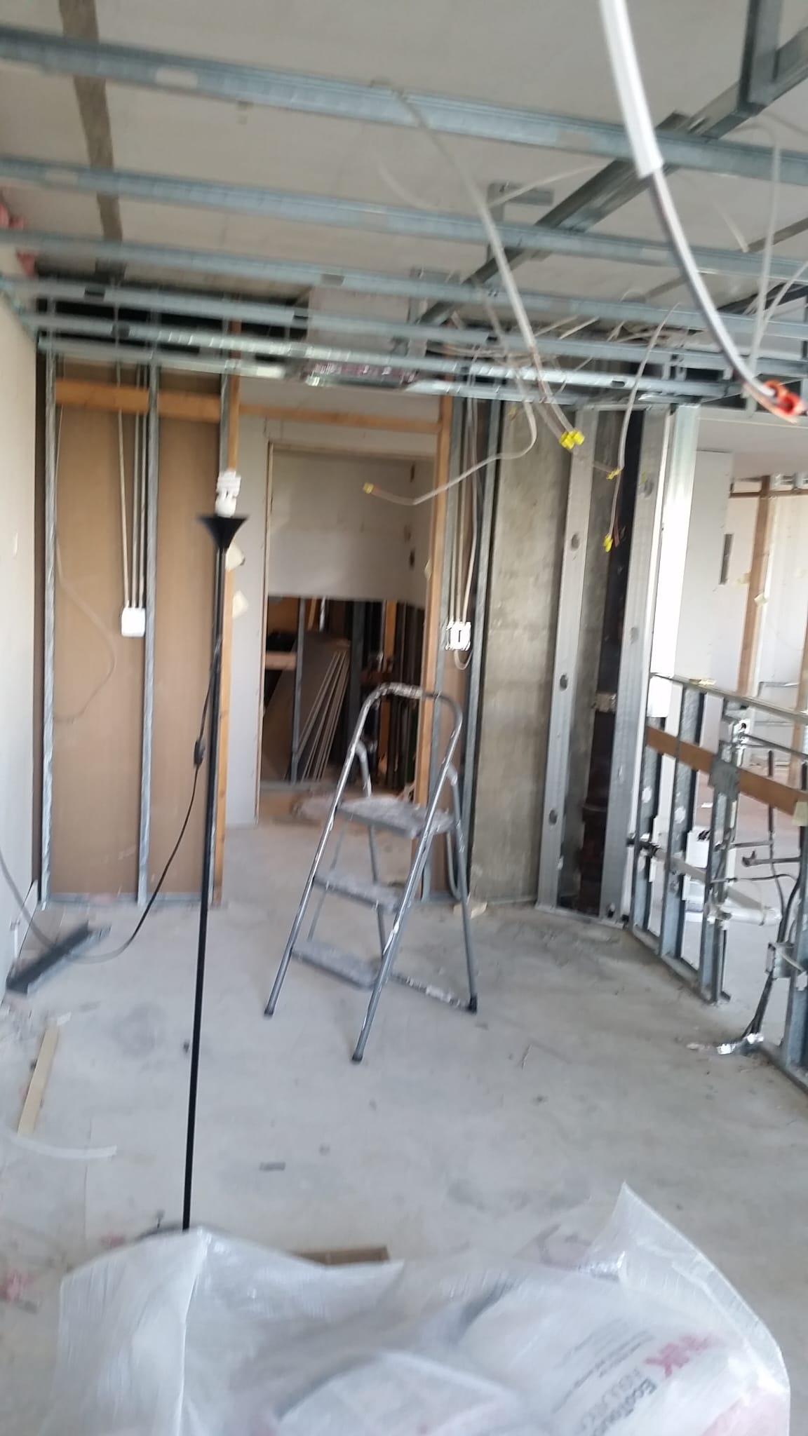 Ceiling and wall framing with electrical work in progress