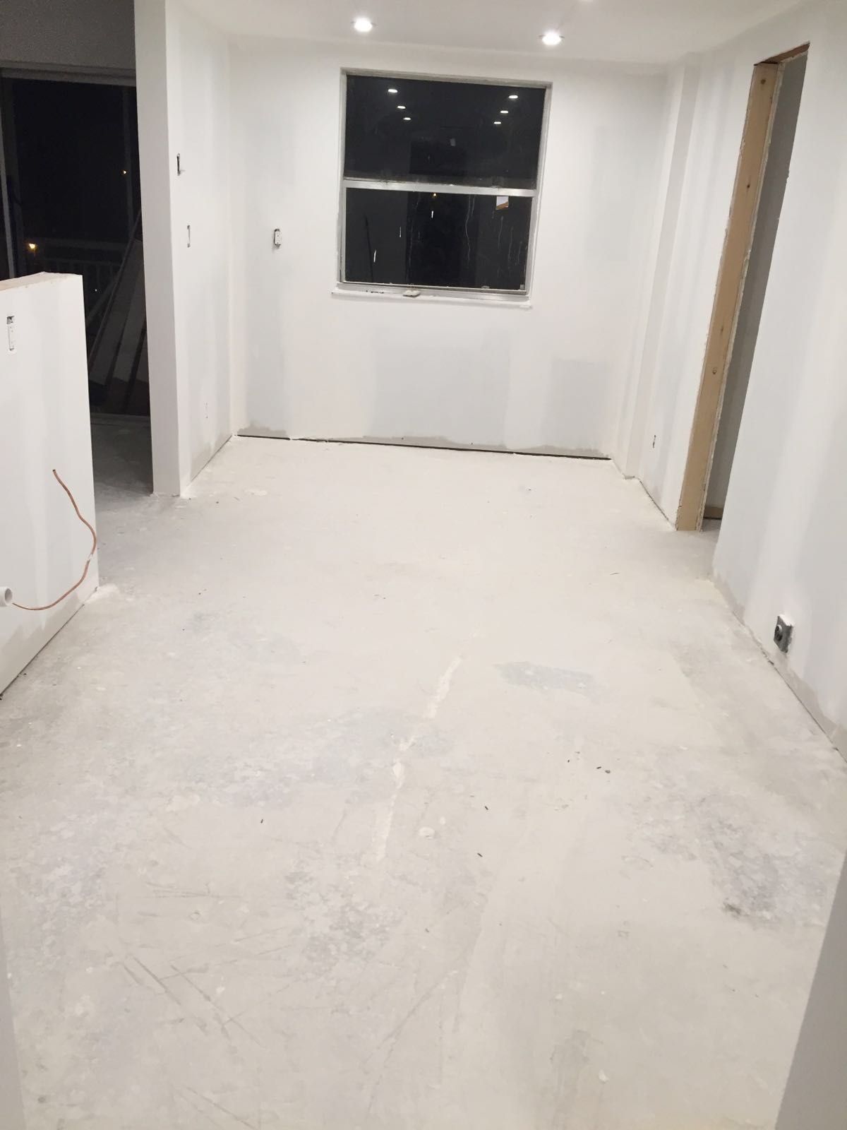 Interior renovation after drywall finishing and recessed-light installation