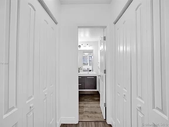 Finished interior hallway with custom closet doors