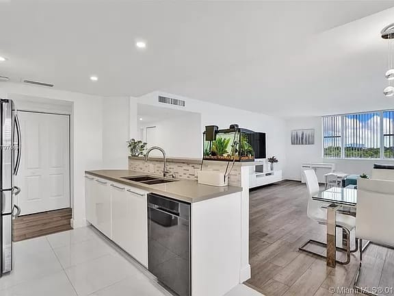 Open kitchen island overlooking the dining and living areas