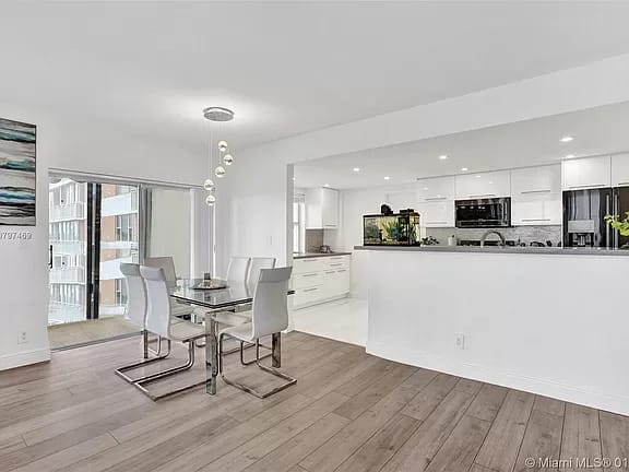 Open white kitchen and dining room renovation